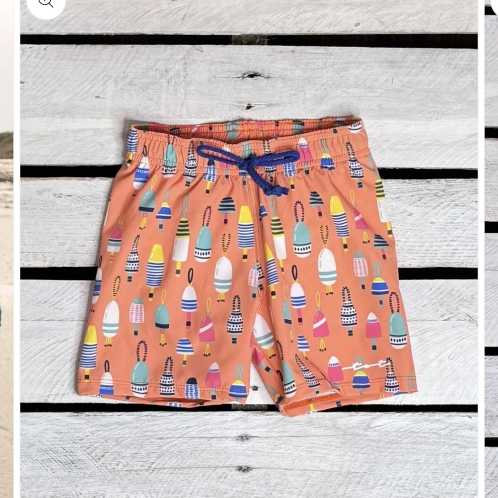 Kids Coral Orange Swim Trunks with Buoy Print